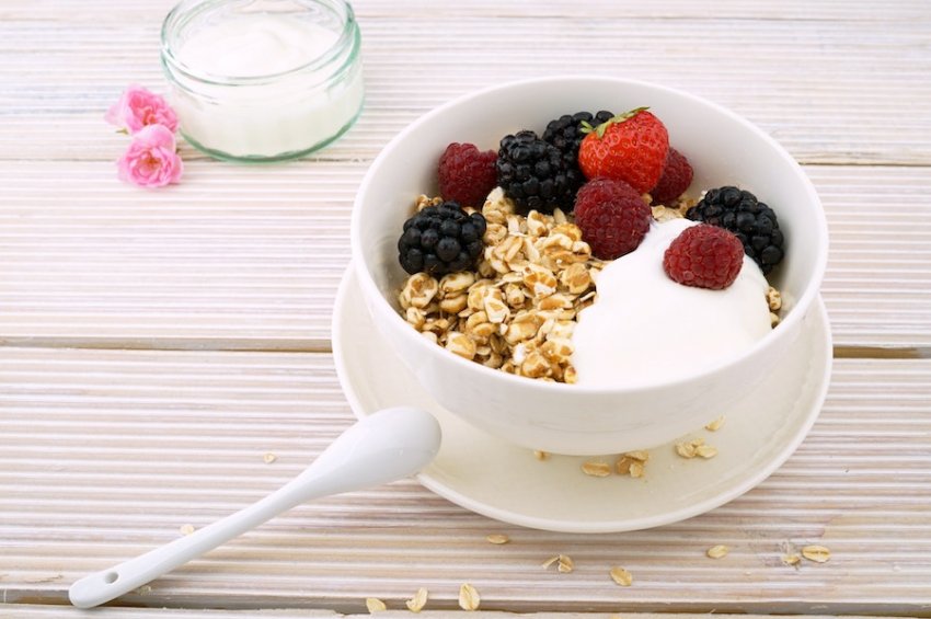Muesli bowl with yoghurt and fruit in a white bowl